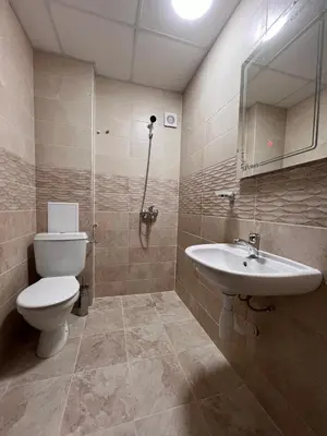 a bathroom with a toilet and a sink at Вихрен-стаи и апартаменти за гости in Sandanski