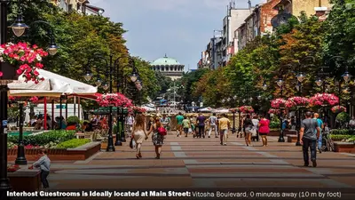 a group of people walking down a street at Interhost Guest rooms and apartments in Sofia