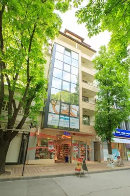 a building with a sign on the side of it at Studio Ivana in Sandanski