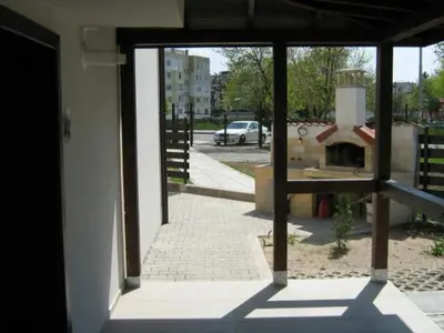 an open door of a building with a view of a street at Khan Krum House & Apartments for rent in Elin Pelin