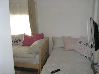 a living room with a couch and a window at Khan Krum House & Apartments for rent in Elin Pelin