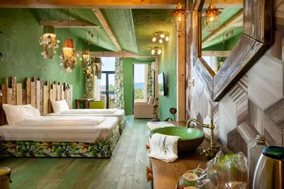 a room with two beds and a sink in it at Boutique Hotel Casa Art in Oreshak