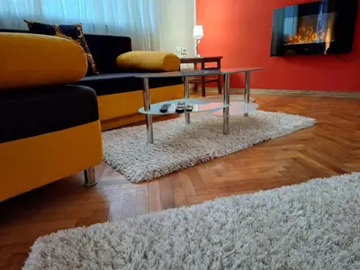 a living room with a couch and a coffee table at Cozy apartment in the heart of Sofia in Sofia