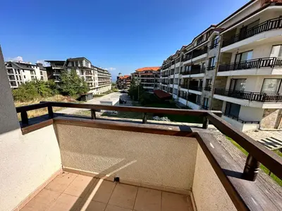 a balcony of a building with a view of a street at White Wood Lodge in Bansko