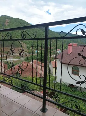 a view from the balcony of a house at Centaur Family Hotel in Rila