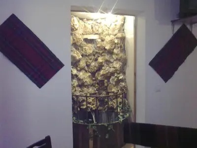 a room with a wall with a stone wall at Hotel Gazei in Bansko