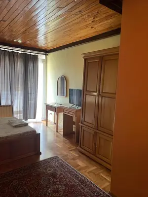 a bedroom with a bed and a desk in a room at Stivan Iskar Hotel in Sofia