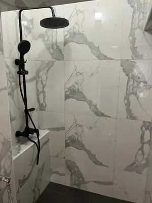 a shower with a microphone in a bathroom at Stivan Iskar Hotel in Sofia