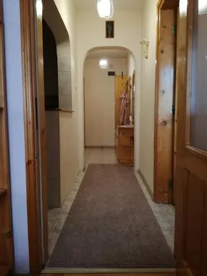 a hallway in a house with a hallway leading into a room at Apartment Beti in Devin