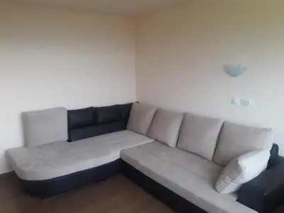 a living room with a couch in a room at Къща за гости Чала in Chala