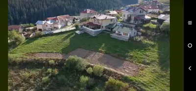 an aerial view of a large house on a hill at Къща за гости Чала in Chala
