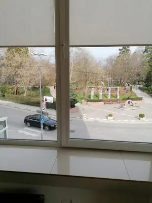 a window with a view of a street at Hotel Lago Peshtera in Peshtera