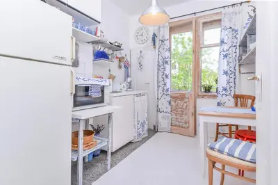 a kitchen with white appliances and a window at Shik & Chic One Bedroom Central Apartment Graf Ignatiev x Shishman Corner by Flat Mаnager in Sofia
