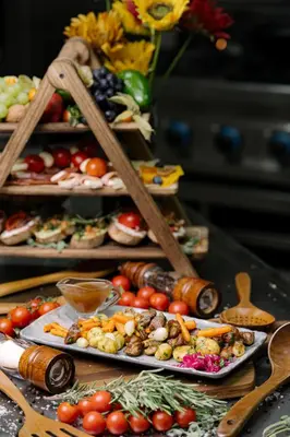 a table with many plates of food on it at Комплекс Кремен in Blagoevgrad