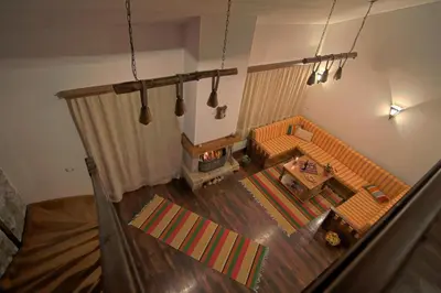 an overhead view of a living room with a couch at Holiday Village Kochorite in Pamporovo