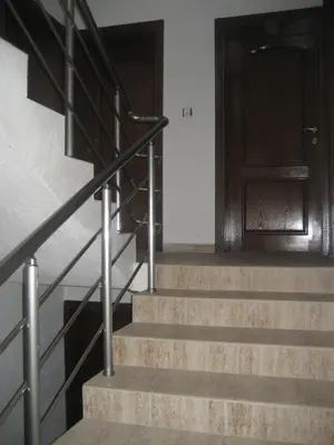 a set of stairs with a wooden door at Guest Rooms Vachin in Bansko
