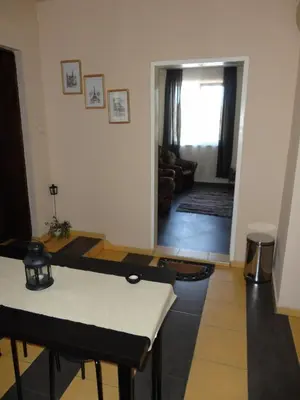 a living room with a table and a couch at Avel Guest House in Sofia