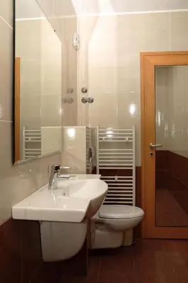 a bathroom with a sink and a toilet and a mirror at BLOCK 531 ApartHouse BLOCK 533 in Sofia