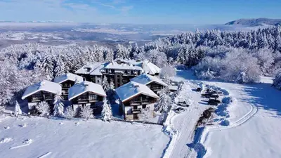 an aerial view of a lodge in the snow at Chamkoria Chalets in Borovets