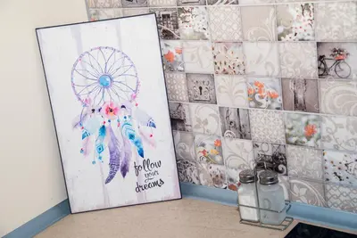 a painting of a dream catcher on a tiled wall at Sofia Central Pretty Apartment in Sofia