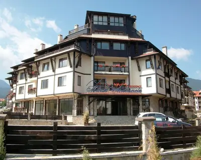 a large building with a car parked in front of it at Maria-Antoaneta Residence in Bansko