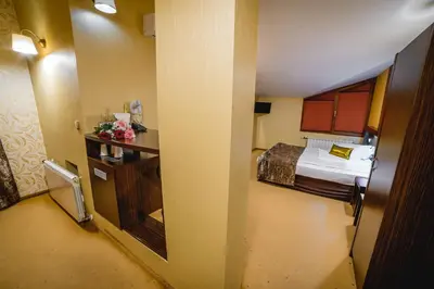a view of a room with a bed and a door at Eleganza Family Hotel - Free Parking in Sofia