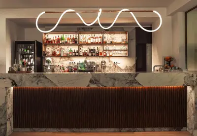 a bar in a restaurant with a sign above it at Family Hotel Edia-Sandanski in Sandanski