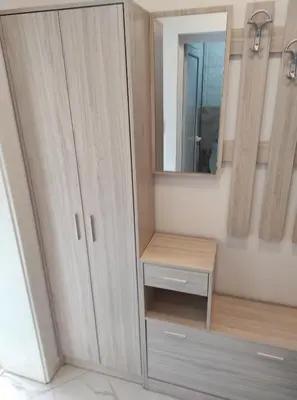 a bathroom with a wooden cabinet and a mirror at Sun Стамат Икономов 11 in Plovdiv