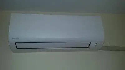a white microwave sitting on top of a ceiling at Sun Стамат Икономов 11 in Plovdiv