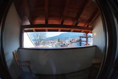 a window in a building with a view of a city at Family Hotel Nadejda in Bansko