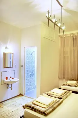 a bathroom with two beds and a sink at Hello Sofia Guesthouse in Sofia