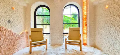two chairs in a room with two windows at Grand Royale Apartment Complex & Spa in Bansko