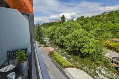 a view of a river from a balcony at Artemis Apartments in Sandanski