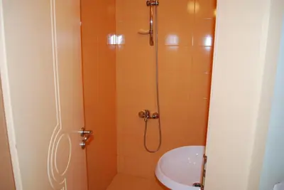 a bathroom with a shower and a sink at Hotel Milenium in Sofia