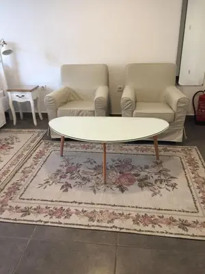 a living room with a couch and a coffee table at Студия Давидов 