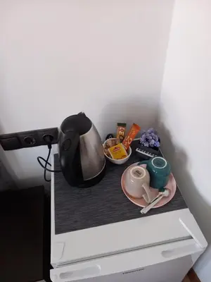 a table with a plate of food on a shelf at Guest house Skabrin in Bansko