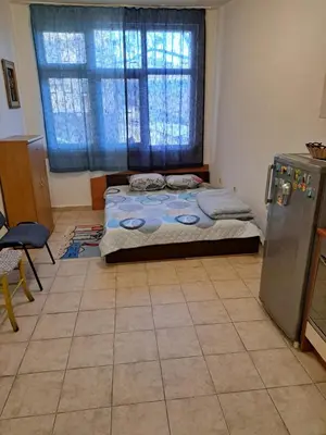 a small bedroom with a bed and a window at relax in Plovdiv