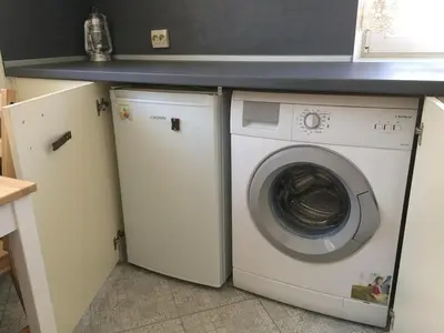 a washing machine and a dryer in a kitchen at Apartment August 11 in Sofia
