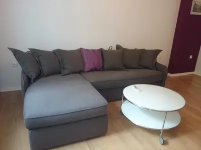a living room with a couch and a table at Solunska Apartment in Sofia