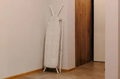 a surfboard hanging on a wall in a room at Vinyl Studio Apartment Sofia in Sofia