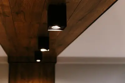 a wooden ceiling with two lights on it at Vinyl Studio Apartment Sofia in Sofia