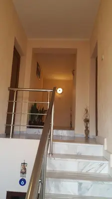 a set of stairs in a building with a railing at Family Hotel Dalia in Velingrad