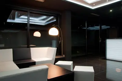 a room with white chairs and a table and lights at Hotel Fashion - Free Parking in Sofia