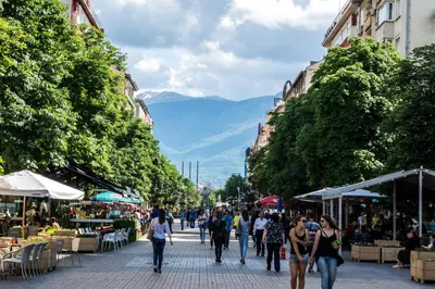a group of people walking down a street at Hostel Mostel Hub Rooms and Apartments in Sofia