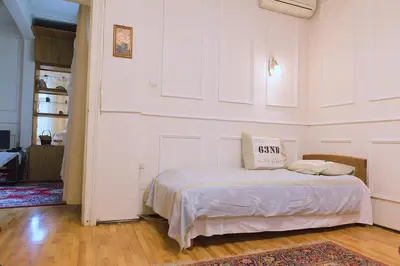 a bedroom with a bed with a pillow on it at Botev Apartment in Sofia