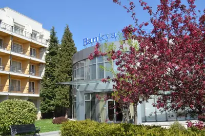 a building with pink flowers in front of it at Hotel Bankya Palace in Bankya