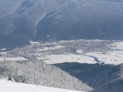 an aerial view of a town in the snow at Kashta Peychevi in Govedartsi