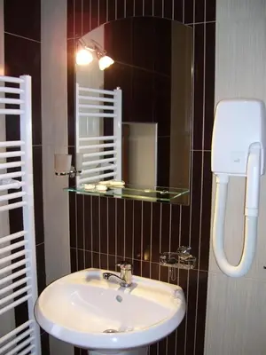 a bathroom with a sink and a mirror at Kashta Peychevi in Govedartsi