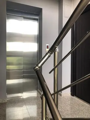 a metal staircase with a door in a building at Apartment Trimontium 2 in Plovdiv