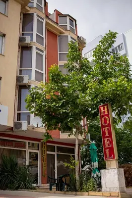 a building with a sign in front of it at Hotel Deva in Sandanski